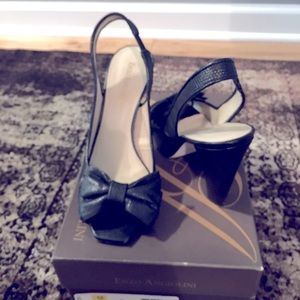 Enzo Angiolini, a black leather upper sling back shoe with a bow on the front